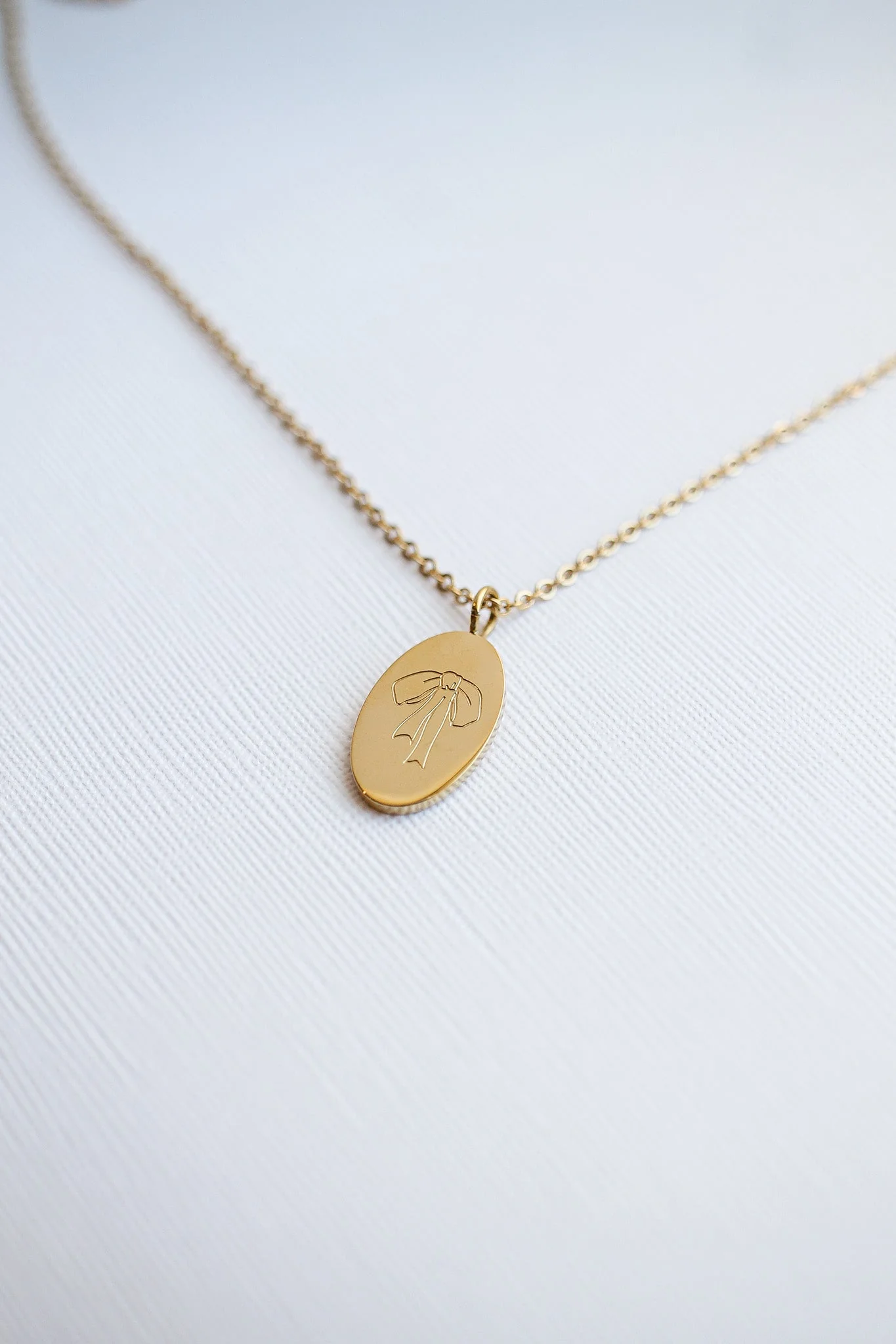Bow Pendant Necklace in Gold - Image 12